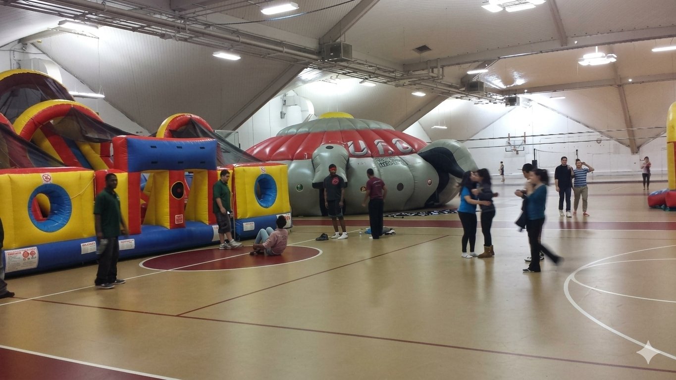 Students enjoying a campus event with inflatable games at Boston College