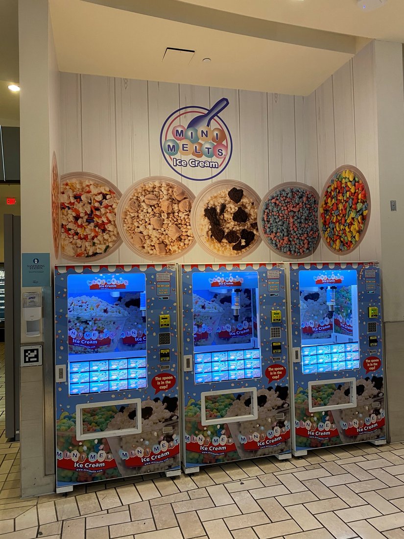 Three Mini Melts vending machines with flavor display at Tysons Corner
